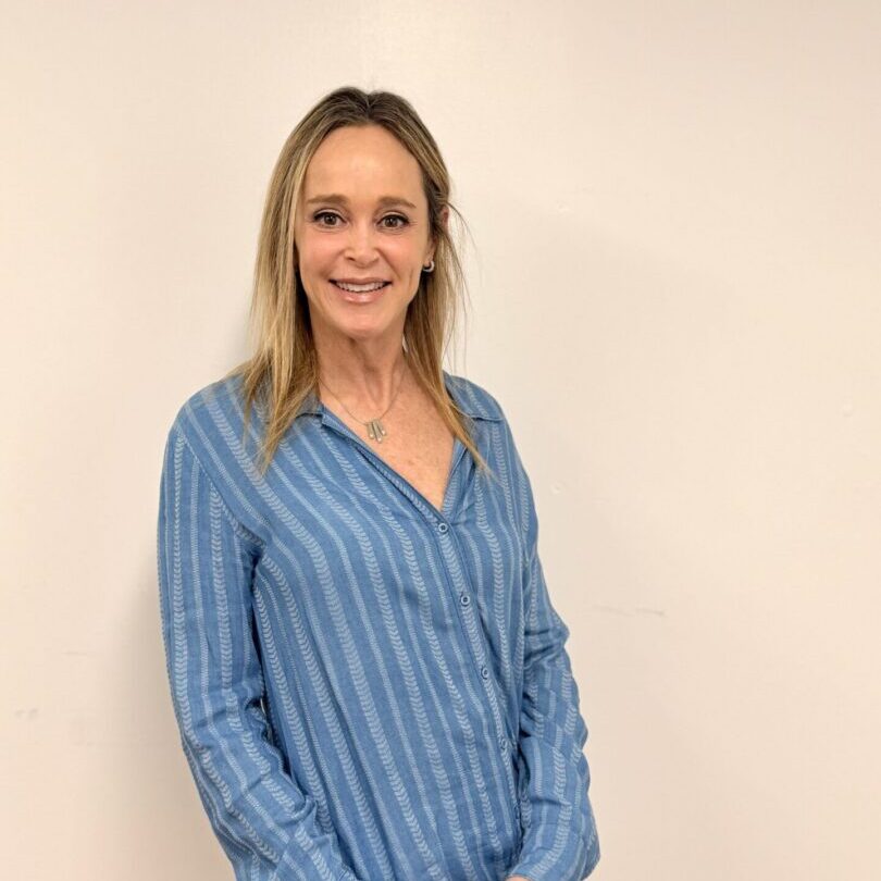 Smiling woman in blue striped blouse