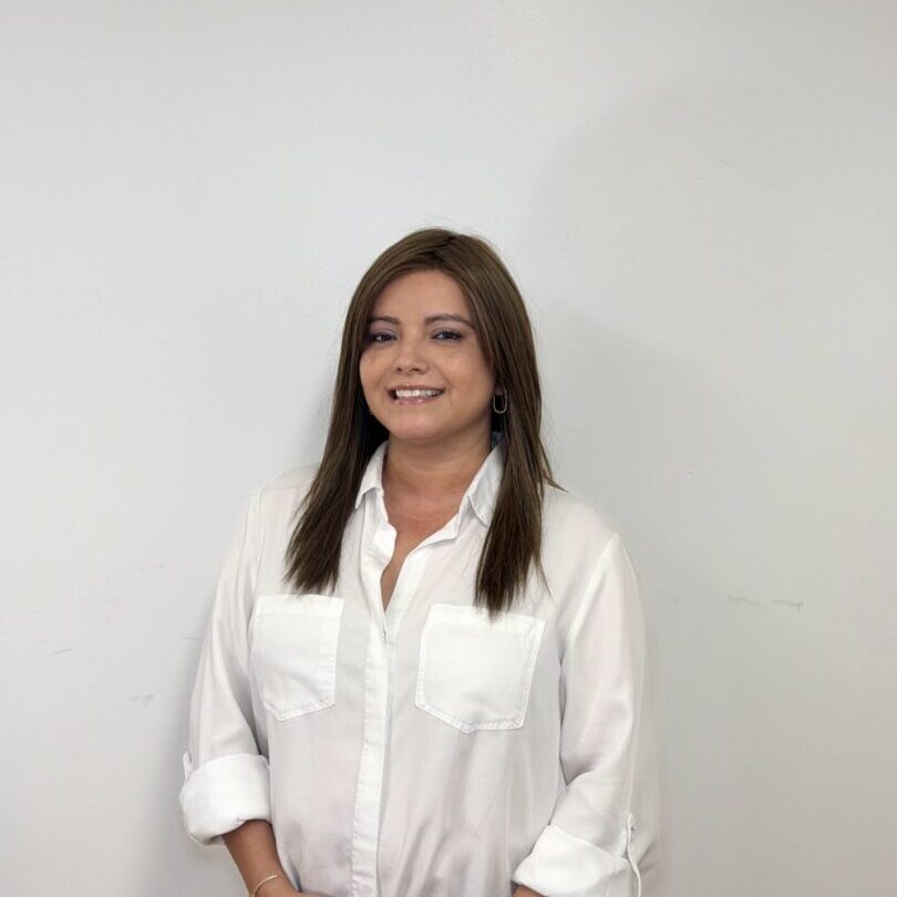 Smiling woman in white blouse