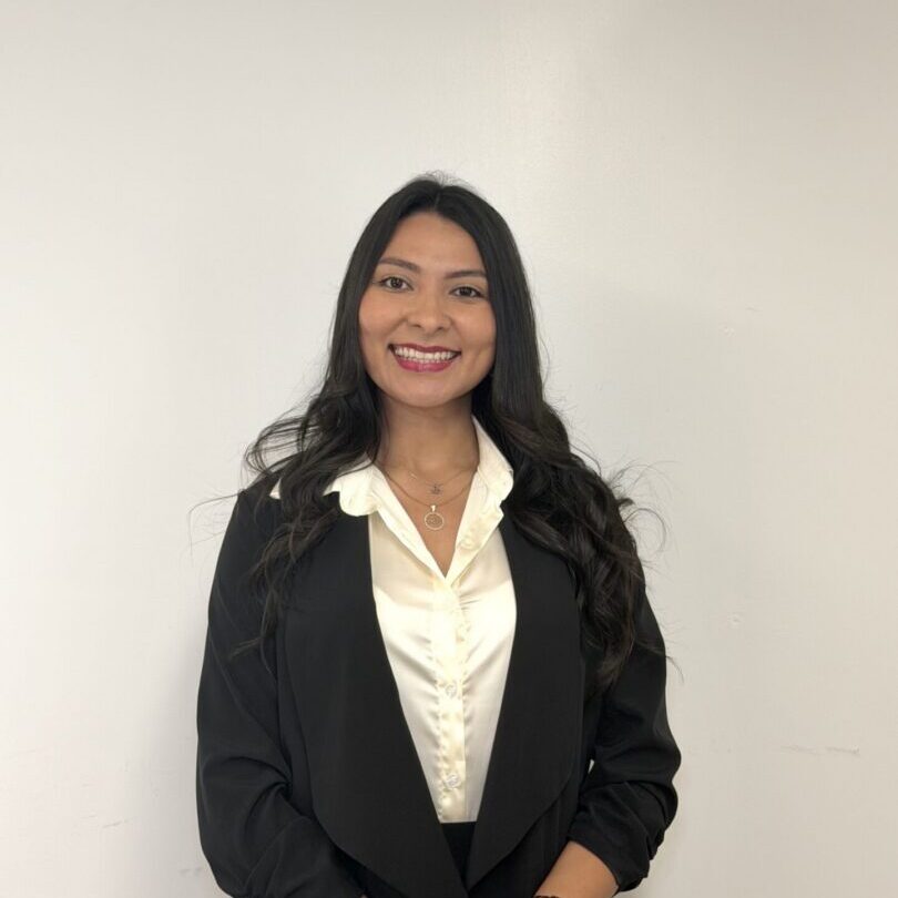 Smiling professional woman in black blazer